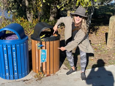Woman cleaning up park — after